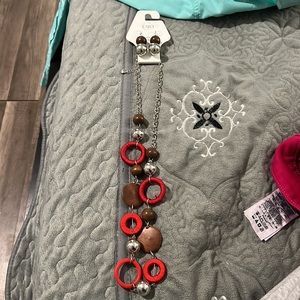 Long pretty necklace with matching earrings. NEW